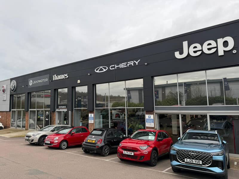 An image of the exterior signage for Thames motor, which includes a Chery and Jeep sign.